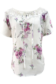 White floral blouse with lace yoke and tie-neck, short sleeves