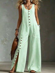 Green button-front wide-leg jumpsuit with side slits and pockets.