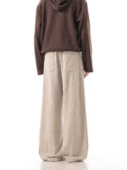 Khaki ribbed sweatpants with wide legs and back pockets.