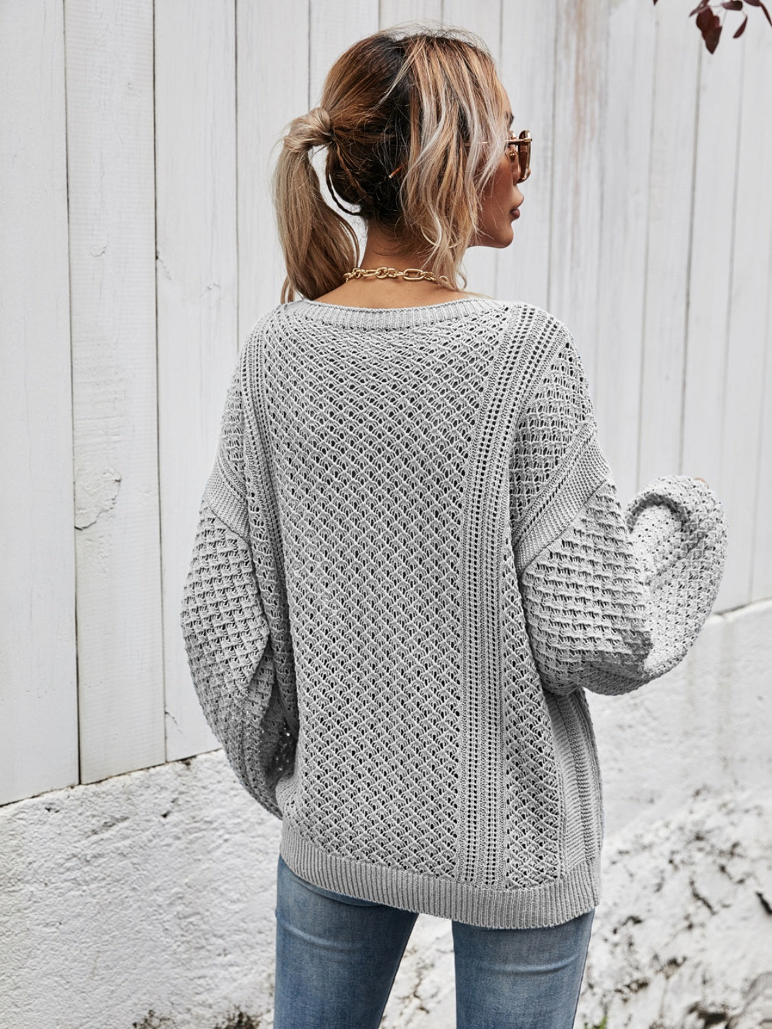 Light Gray open-knit sweater with balloon sleeves and a diamond pattern.