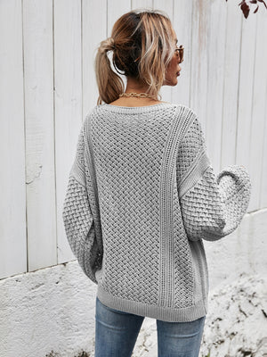 Light Gray open-knit sweater with balloon sleeves and a diamond pattern.