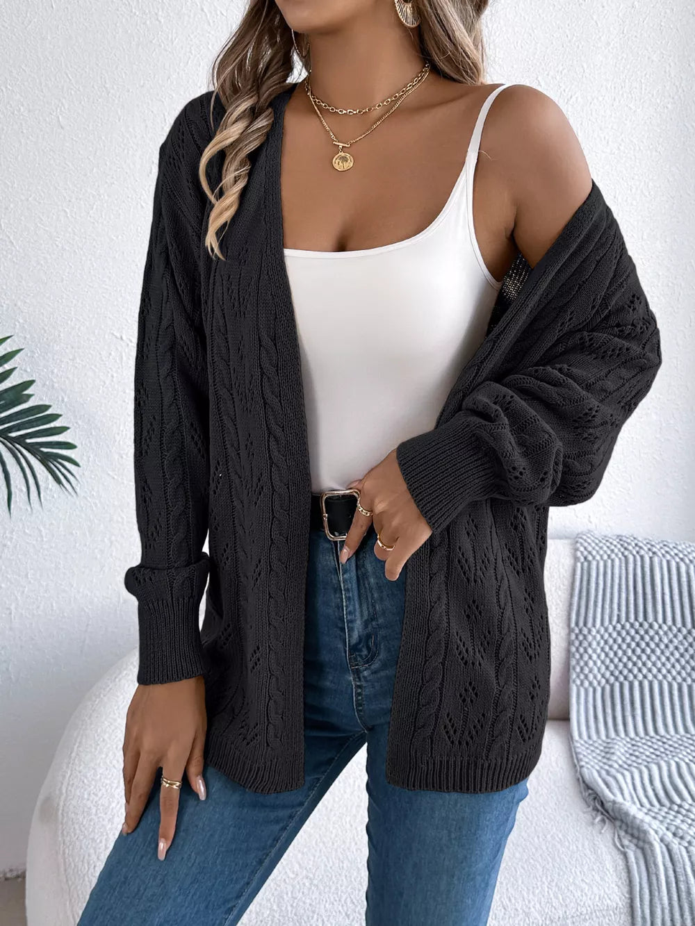 Black acrylic openwork cable knit long sleeve cardigan with open front