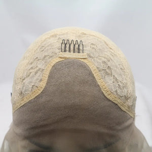 Ombre pink blunt cut wig cap construction with combs and lace detail.