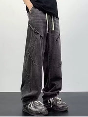 Gray oversized drawstring waist jeans with cargo pockets and a relaxed fit.