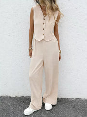 Chic beige button-down vest and flowing wide-leg pants set for women.