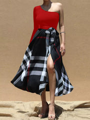 Red one-shoulder midi dress with a black plaid wrap skirt and waist tie.
