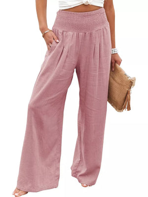 Dusty Pink smocked maternity pants with wide legs and pockets.