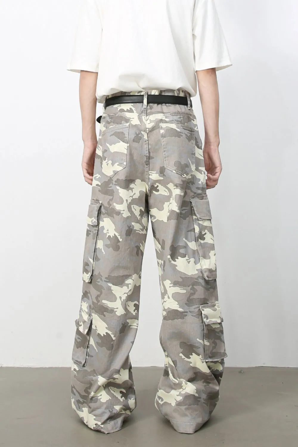 Urban Warrior cargo jeans in gray camouflage print with multiple pockets and a relaxed fit.