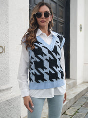 Houndstooth knit v-neck pullover vest in black and blue acrylic with light blue trim.