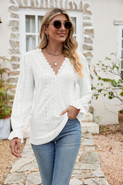 White eyelet lace blouse with ruffle sleeves and V-neckline