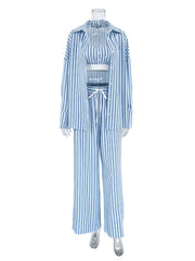 Blue and white striped three-piece pajama set with cami, button-up shirt, and wide-leg pants.