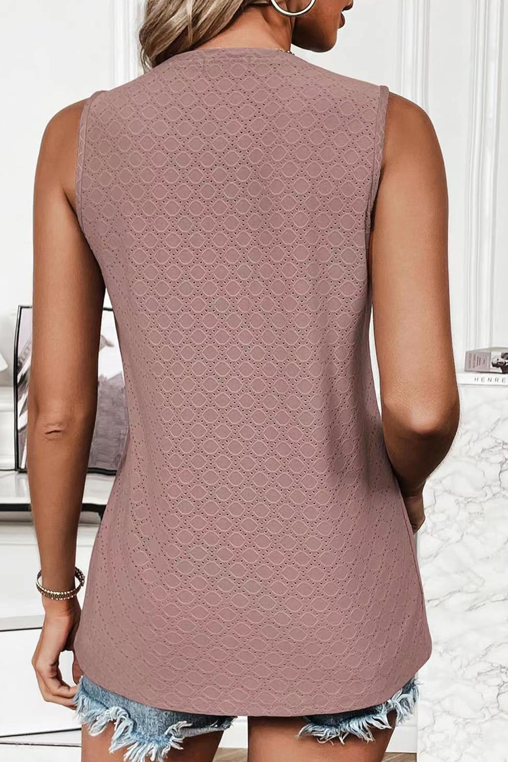 Textured sleeveless scoop neck top in blush pink with a geometric pattern.