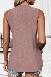 Textured sleeveless scoop neck top in blush pink with a geometric pattern.