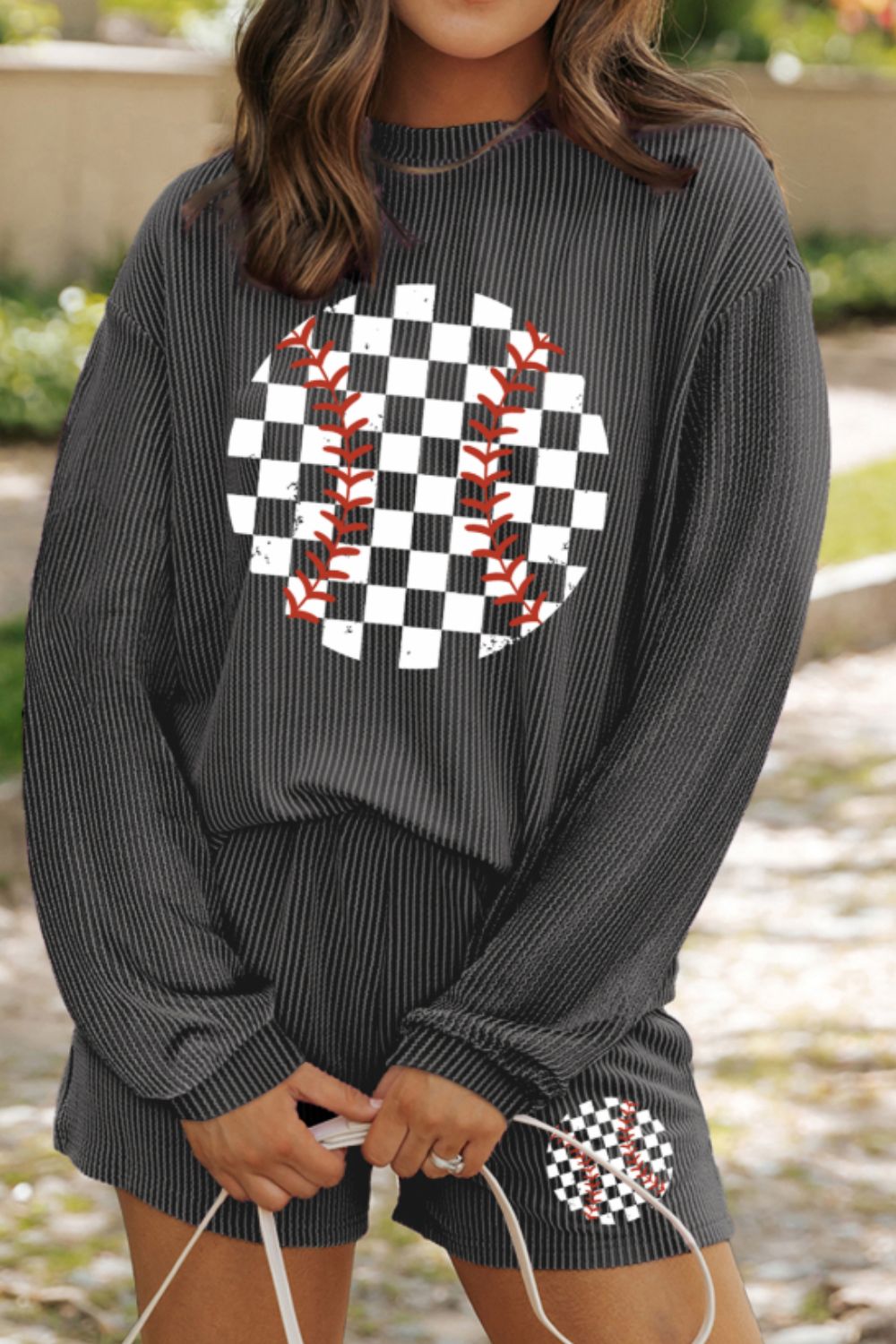 Dark gray ribbed loungewear set with baseball graphic on top and shorts.