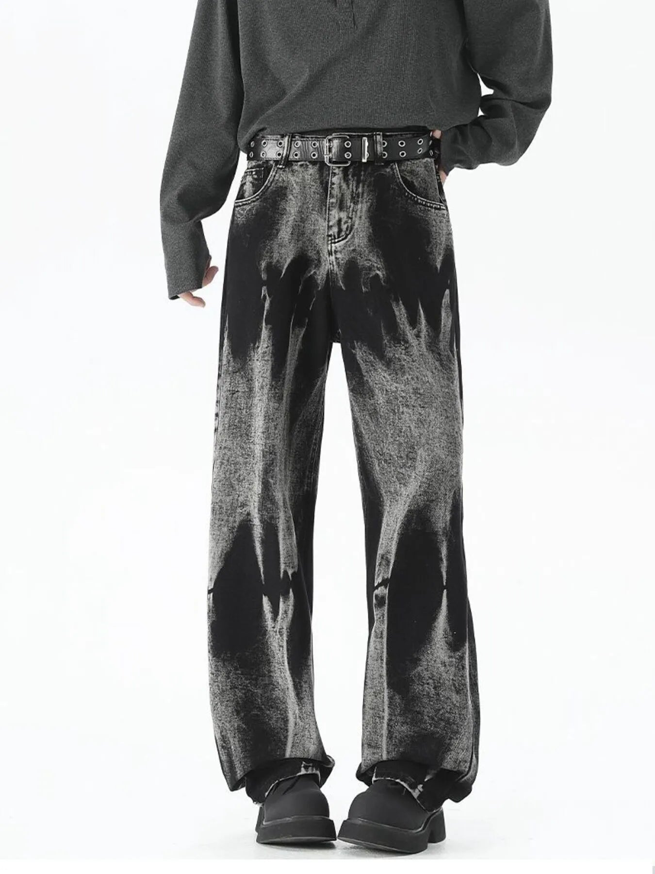 Men's black relaxed fit jeans with acid wash detail and belted waist