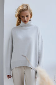 Light Gray oversized cashmere turtleneck sweater with ribbed cuffs and hem.