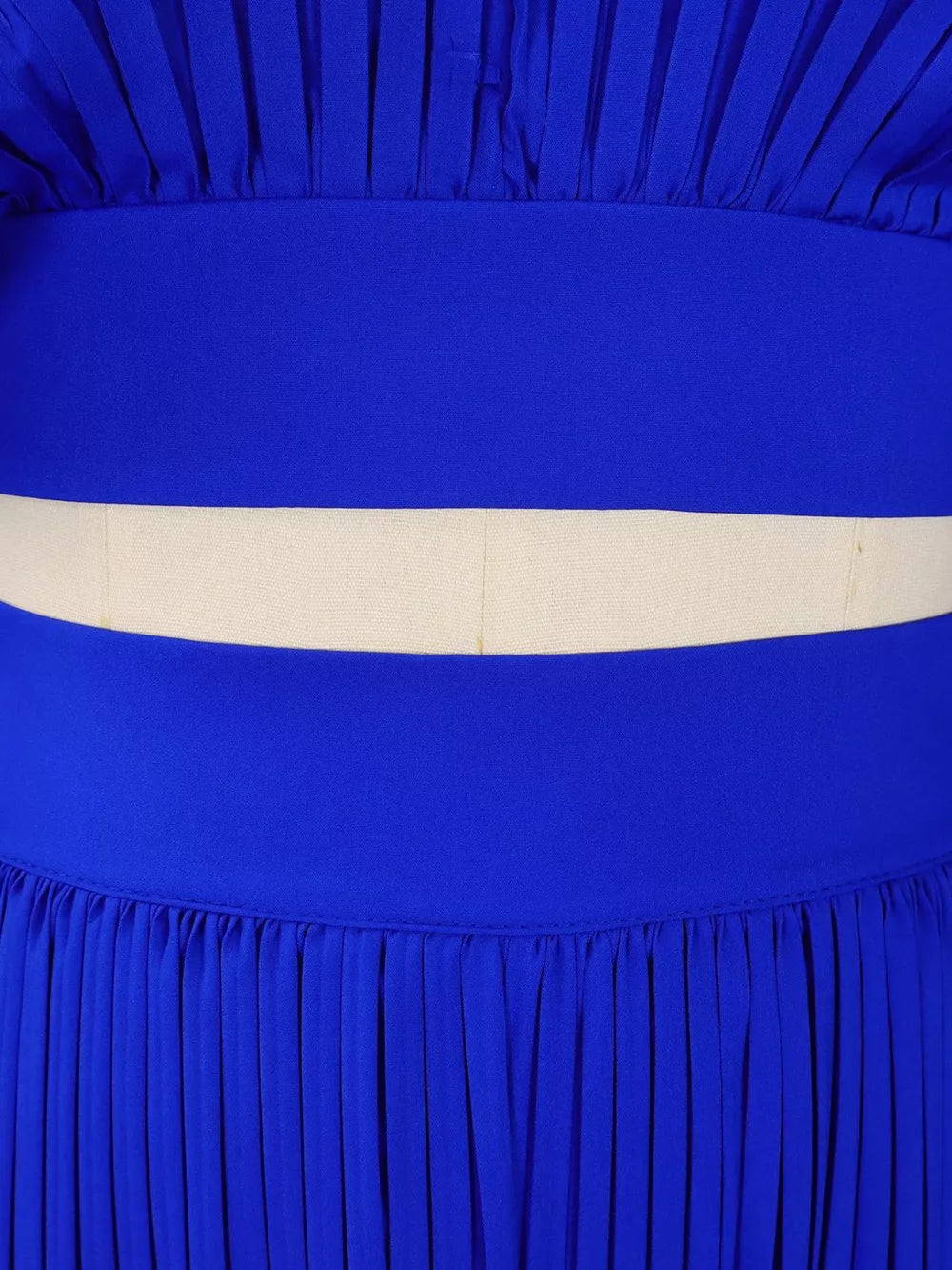 Blue pleated two-piece set with a cream waistband detail and wide legs.