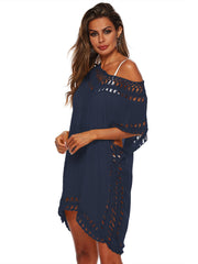 Dark blue kaftan cover-up with crochet trim on neckline, sleeves, and hem.
