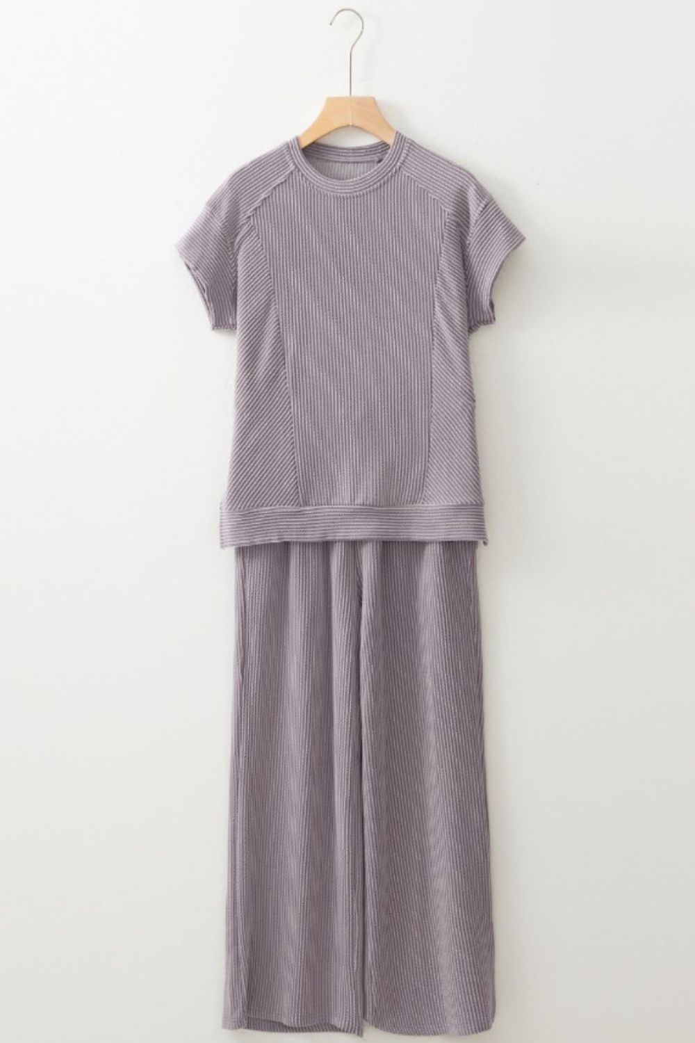 Gray ribbed knit drawstring co-ord set with short sleeves and wide-leg pants.