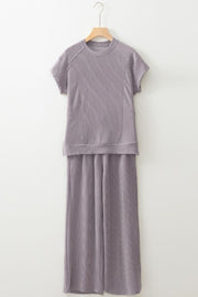 Gray ribbed knit drawstring co-ord set with short sleeves and wide-leg pants.