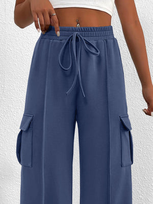 Blue high waist cargo sweatpants with drawstring and side pockets.