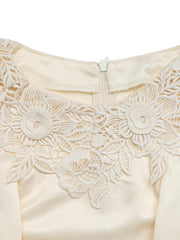Apricot satin blouse with intricate floral lace neckline detail and zipper closure.