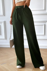 Matcha green textured rib wide-leg drawstring trousers with a relaxed fit.