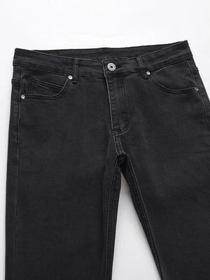 Black wash jeans with split hem detail and classic five-pocket styling.