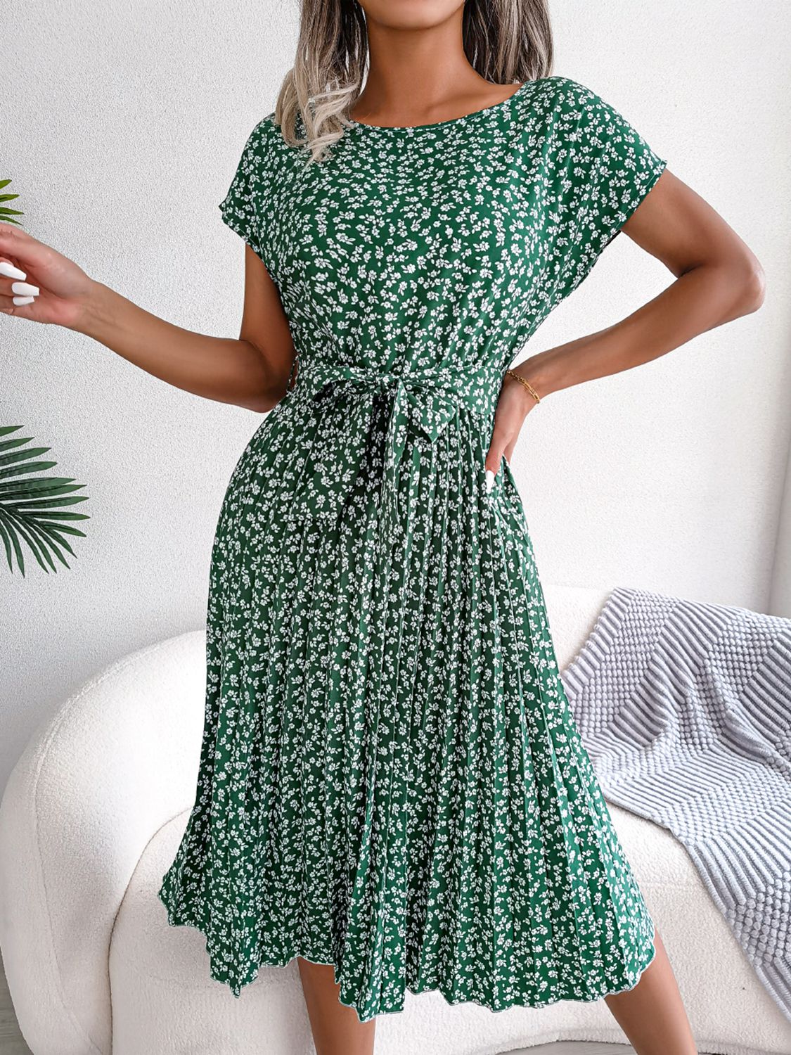 Green floral print midi dress with tie waist and pleated skirt