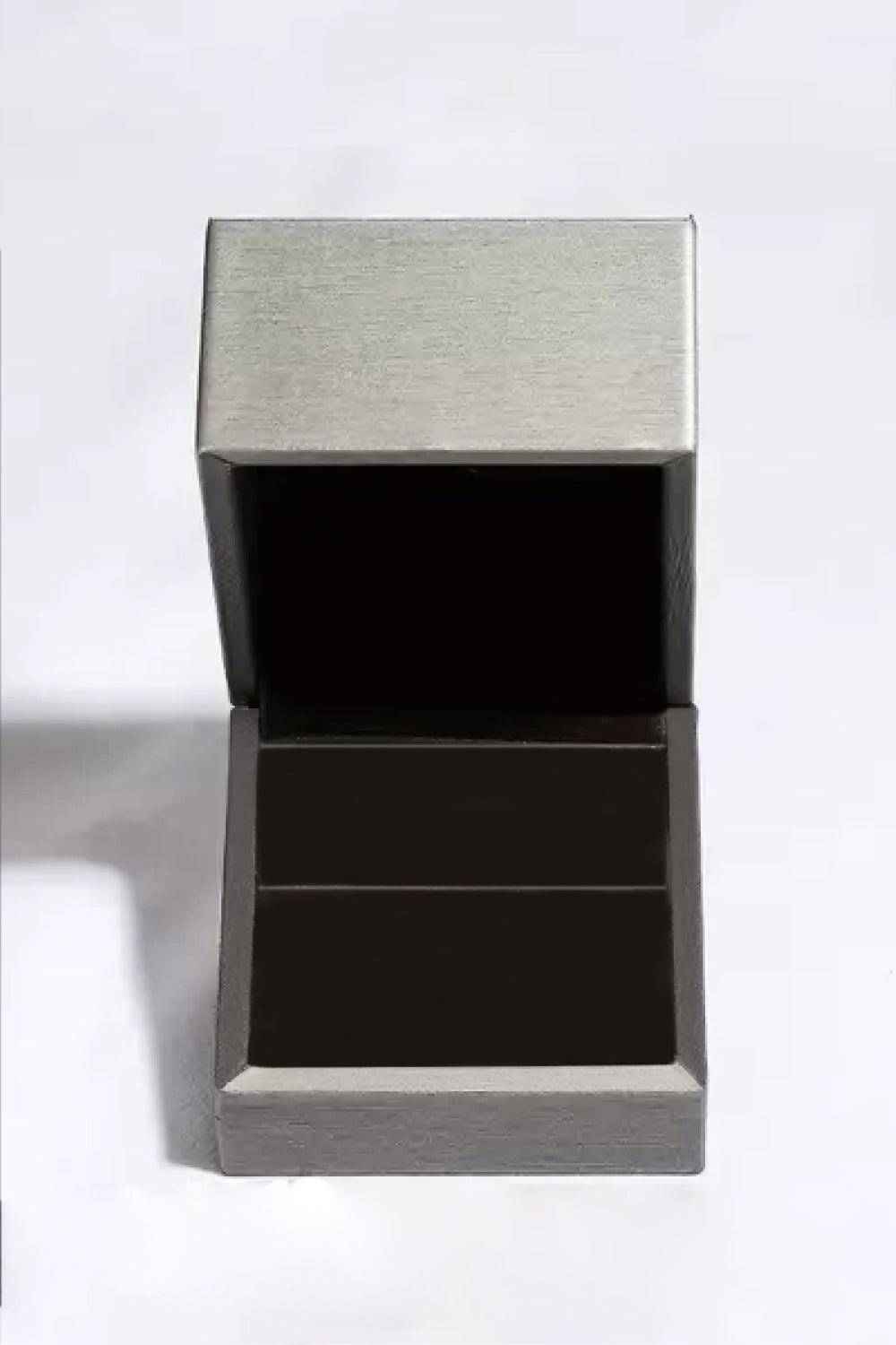 Silver jewelry box with open lid and black interior
