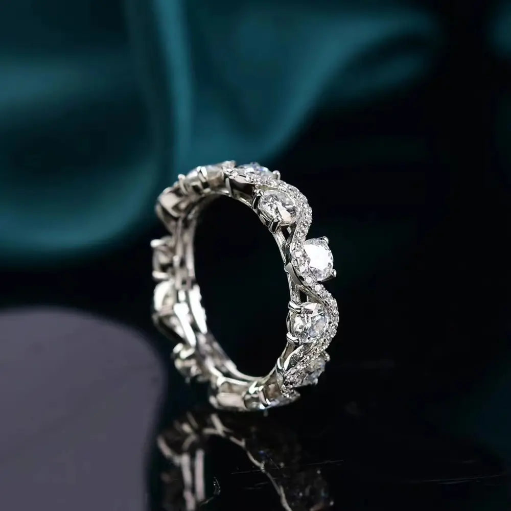 Silver moissanite eternity wave ring with sparkling stones