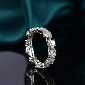 Silver moissanite eternity wave ring with sparkling stones