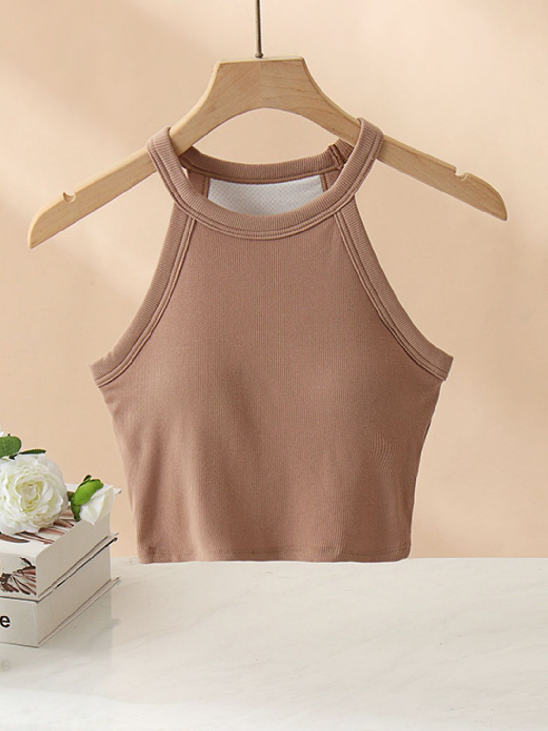 Camel ribbed halter crop top with contrast stitching and a racerback detail.