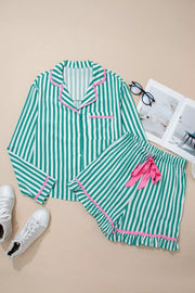 Green and white striped pajama set with pink trim and ruffle shorts.