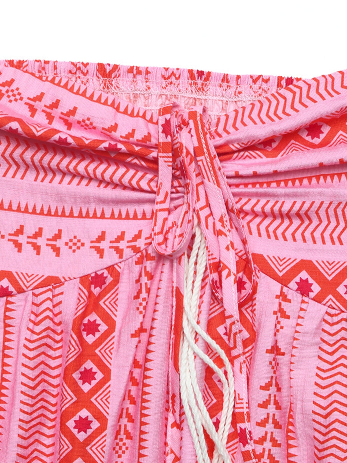 Pink halter neck midi dress with red geometric print and drawstring detail