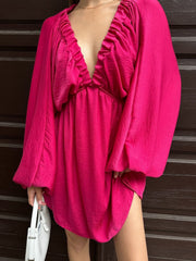 Ruched V-neck dress with balloon sleeves in deep rose, featuring a cinched waist and flowy skirt.