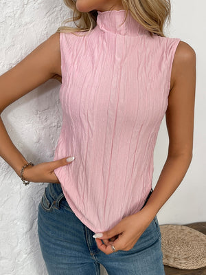 Textured sleeveless mock neck top in blush pink with vertical crinkle detail