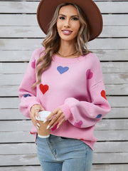 Pink acrylic knit sweater with heart motif and bubble sleeves