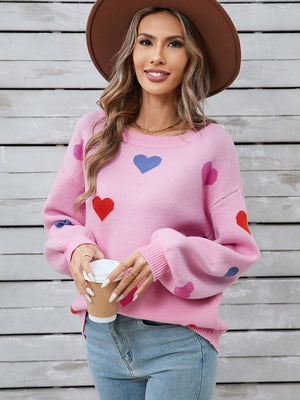 Pink acrylic knit sweater with heart motif and bubble sleeves