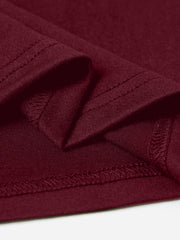 Burgundy maternity t-shirt detail showing hem and stitching.