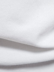 White piqué polo shirt fabric detail showing textured weave