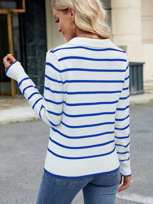 Polo-neck knit top with blue and white Breton stripes, long sleeves, and ribbed cuffs.