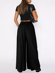Black drape-front wide-leg jersey trousers with elastic waistband