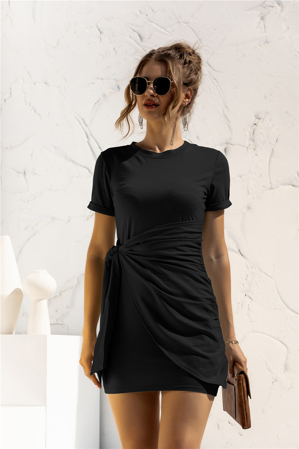 Black jersey mini dress with short sleeves and a knot-front detail