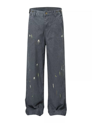 Grey sweatpants with loose fit and ink splash details.