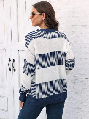 Striped knit crewneck sweater with ribbed trim in navy and white acrylic.