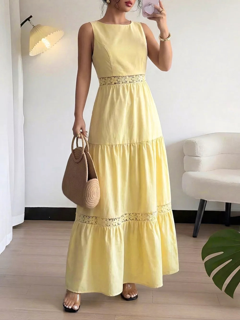 Yellow tiered maxi dress with lace trim detail and cutout waist.