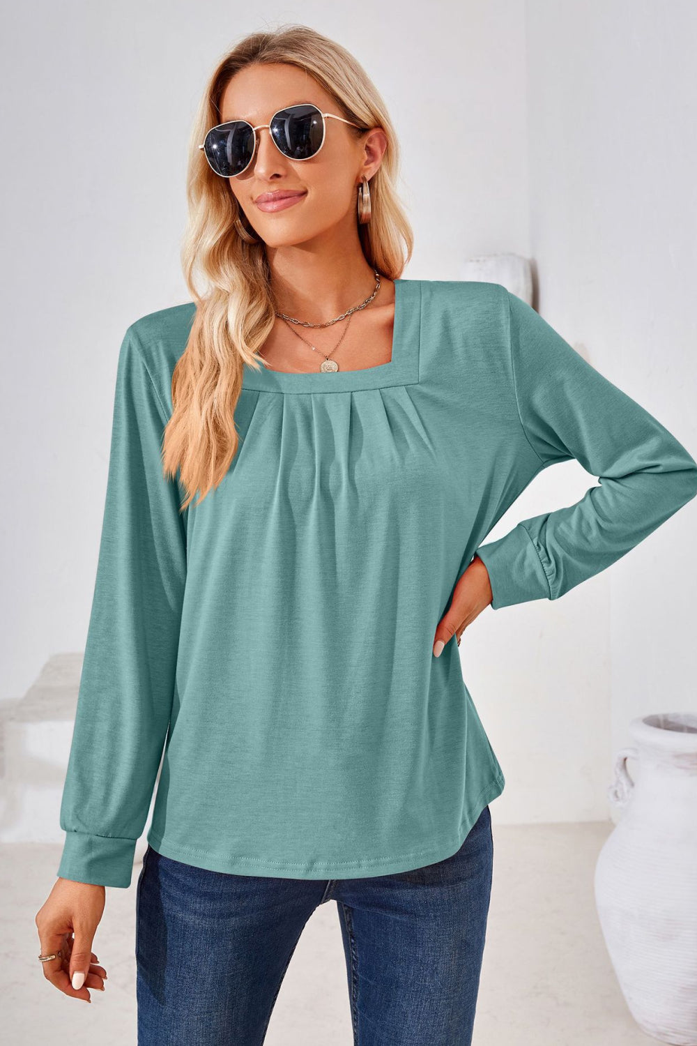 Teal jersey top with gathered square neckline and long sleeves