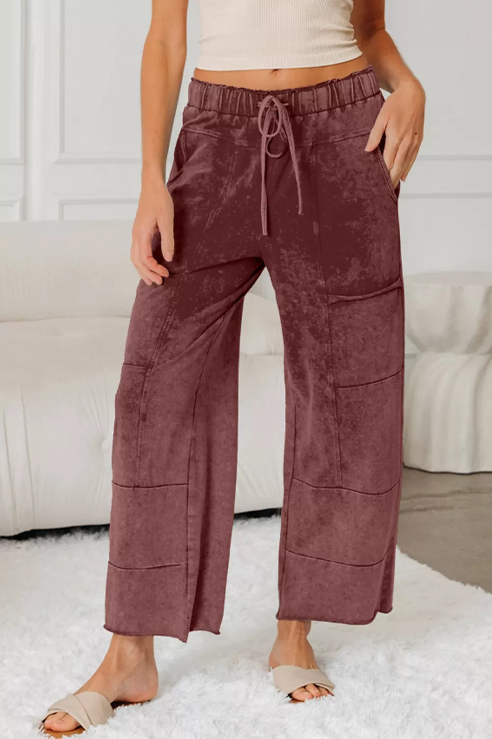 Relaxed wide-leg cotton maternity pants in dusty rose with drawstring waist and pockets.