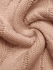 Pink cable knit sweater vest in acrylic fabric, showing texture detail.